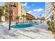 Outdoor pool area with lounge chairs, mature landscaping, and clear blue water at 5511 N Ocean Blvd. # 209, Myrtle Beach, SC 29577