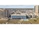 Aerial view of a condo complex with community pool, parking lot, and nearby residential area at 5600 Ocean Blvd. N # A11, North Myrtle Beach, SC 29582