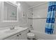 Clean bathroom with white fixtures, a shower-tub combo, and coastal-themed decor at 5600 Ocean Blvd. N # A11, North Myrtle Beach, SC 29582