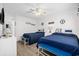 Cozy bedroom featuring two beds with nautical decor and light wooden floors, creating a relaxing coastal retreat at 5600 Ocean Blvd. N # A11, North Myrtle Beach, SC 29582