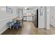 Cozy dining area with seating for four, adjacent to a well-equipped kitchen with stainless appliances at 5600 Ocean Blvd. N # A11, North Myrtle Beach, SC 29582