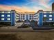 Attractive condo complex with blue siding, white balconies, and ample parking, creating a welcoming coastal residence at 5600 Ocean Blvd. N # A11, North Myrtle Beach, SC 29582