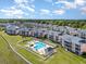 Aerial view of a community with a pool, landscaped grounds, and several buildings at 619 Waterway Village Blvd. # 7C, Myrtle Beach, SC 29579