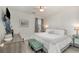Comfortable bedroom with white linens, accent pillows, and a green ottoman at 619 Waterway Village Blvd. # 7C, Myrtle Beach, SC 29579