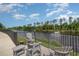 Relax on the waterfront deck with comfortable seating and serene water views at 619 Waterway Village Blvd. # 7C, Myrtle Beach, SC 29579