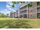 Exterior shot of three-story condos showcasing serene views from screened patios and overlooking lush green space at 619 Waterway Village Blvd. # 7C, Myrtle Beach, SC 29579
