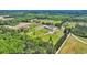 Aerial view of the property showing various structures, green spaces, and surrounding landscape at 6200 Adrian Pkwy., Conway, SC 29526
