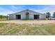 Large horse barn featuring two open doorways and well-maintained grounds at 6200 Adrian Pkwy., Conway, SC 29526