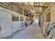 Inside of horse barn showing wooden stalls and lighting at 6200 Adrian Pkwy., Conway, SC 29526