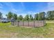 Outdoor horse pen with metal fencing, surrounded by green grass and trees at 6200 Adrian Pkwy., Conway, SC 29526