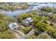 Breathtaking aerial view showcases a charming home surrounded by mature trees, offering waterfront access at 675 Wedgewood Dr., Murrells Inlet, SC 29576