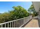 Balcony offers serene views of lush trees and a tranquil atmosphere, perfect for relaxation and enjoying nature at 675 Wedgewood Dr., Murrells Inlet, SC 29576