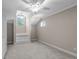 An airy bedroom with carpeting, natural light from two windows, and unique architectural features at 675 Wedgewood Dr., Murrells Inlet, SC 29576