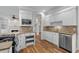 Gourmet kitchen features custom cabinets, granite countertops, modern appliances, and hardwood flooring at 675 Wedgewood Dr., Murrells Inlet, SC 29576