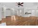 Spacious living area with hardwood floors connecting the living room, dining area, and modern kitchen at 675 Wedgewood Dr., Murrells Inlet, SC 29576