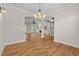 Open-concept living area with hardwood floors, stylish lighting, and easy access to the kitchen and living room at 675 Wedgewood Dr., Murrells Inlet, SC 29576