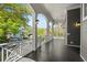 A wrap-around porch with columns and plenty of space for outdoor seating and entertaining at 675 Wedgewood Dr., Murrells Inlet, SC 29576
