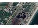 Aerial view of the community showcasing the homes, lake, amenities, and proximity to Litchfield Beach at 70 Mingo Dr. # 3-E, Pawleys Island, SC 29585