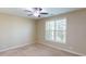 Bright bedroom with carpeted floor, a ceiling fan, and a large window at 70 Mingo Dr. # 3-E, Pawleys Island, SC 29585