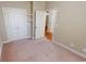 Bedroom with closet, ensuite and neutral carpet at 70 Mingo Dr. # 3-E, Pawleys Island, SC 29585