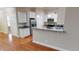 Bright kitchen featuring stainless steel appliances, granite countertops, and a convenient breakfast bar at 70 Mingo Dr. # 3-E, Pawleys Island, SC 29585