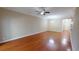 Large living room features hardwood floors and a ceiling fan at 70 Mingo Dr. # 3-E, Pawleys Island, SC 29585