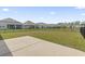 Spacious backyard featuring a black fence and pond view perfect for outdoor enjoyment at 7005 Grant St., Little River, SC 29566