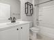 Bright bathroom featuring a single sink vanity, stylish fixtures, and a shower-tub combination at 7005 Grant St., Little River, SC 29566