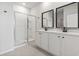 Bright bathroom with dual sinks, modern fixtures, and a glass-enclosed shower at 7005 Grant St., Little River, SC 29566