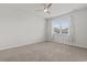 Bedroom with a ceiling fan, carpeted flooring and natural light at 7005 Grant St., Little River, SC 29566