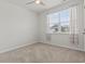A light and airy bedroom featuring neutral paint, a ceiling fan, carpet and a window view at 7005 Grant St., Little River, SC 29566