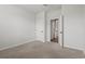 Neutral bedroom with beige carpet, white walls, and a ceiling fan at 7005 Grant St., Little River, SC 29566