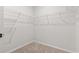 Neutral closet with wire shelving and beige carpet offers tidy storage at 7005 Grant St., Little River, SC 29566