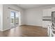 Bright dining area with hardwood floors and sliding glass doors to the screened porch at 7005 Grant St., Little River, SC 29566