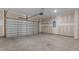 Spacious garage with concrete floor and unfinished drywall walls at 7005 Grant St., Little River, SC 29566
