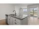 Eat-in island in kitchen featuring stainless steel dishwasher and modern pendant lights at 7005 Grant St., Little River, SC 29566