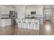 Bright kitchen featuring an island with seating, stainless appliances and white cabinetry at 7005 Grant St., Little River, SC 29566