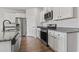 Modern kitchen with stainless steel appliances and granite countertops at 7005 Grant St., Little River, SC 29566