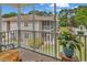 Screened balcony overlooks lush landscaping in a condominium community at 7207 Sweetwater Blvd. # 7207, Murrells Inlet, SC 29576