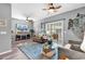 Comfortable living room with ample seating, ceiling fan and sliding glass doors to patio at 7207 Sweetwater Blvd. # 7207, Murrells Inlet, SC 29576