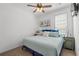 Relaxing bedroom with cozy décor, blue accents, and plenty of natural light from a window at 77 Weatherboard Ct., Pawleys Island, SC 29585