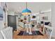 Open concept dining area with bright lighting and seamless flow into the living room at 77 Weatherboard Ct., Pawleys Island, SC 29585