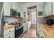 Cozy kitchen featuring stainless steel appliances, tile backsplash, and butcher block countertops at 77 Weatherboard Ct., Pawleys Island, SC 29585
