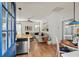 Inviting open-concept living space featuring hardwood floors, a cozy sectional sofa, and stylish nautical decor at 77 Weatherboard Ct., Pawleys Island, SC 29585
