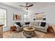 Bright living room with neutral colored sectional sofa, ceiling fan, and nautical decorations at 77 Weatherboard Ct., Pawleys Island, SC 29585