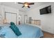 Cozy main bedroom with large bed, closet, and view of the en suite bathroom at 77 Weatherboard Ct., Pawleys Island, SC 29585