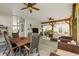Inviting patio offers wood beams, ceiling fans, dining, and cozy seating areas at 77 Weatherboard Ct., Pawleys Island, SC 29585