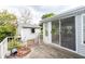 Exterior view of a patio with a sliding glass door leading inside and a storage shed in the backyard at 835 South Marlin Circle, Murrells Inlet, SC 29576