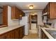 Practical kitchen featuring wood cabinets, white appliances, and ample counter space at 835 South Marlin Circle, Murrells Inlet, SC 29576