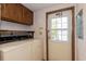 Laundry room with washer, dryer, and access to the backyard at 835 South Marlin Circle, Murrells Inlet, SC 29576